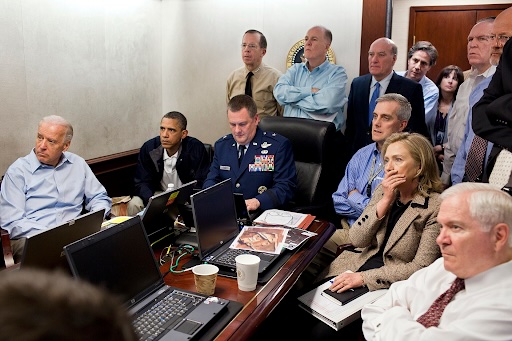 President Barack Obama, Vice President Joe Biden, Secretary of State Hillary Clinton, and national security officials watch a live operation update in the White House Situation Room.