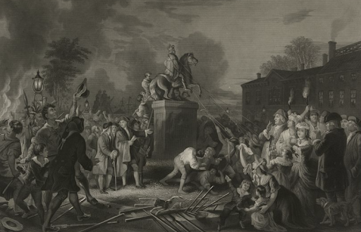 A black-and-white engraving depicts a large crowd of people pulling down a statue of a man on horseback during the night. The scene is lit by lanterns and a fire, with people using ropes to topple the statue from its pedestal