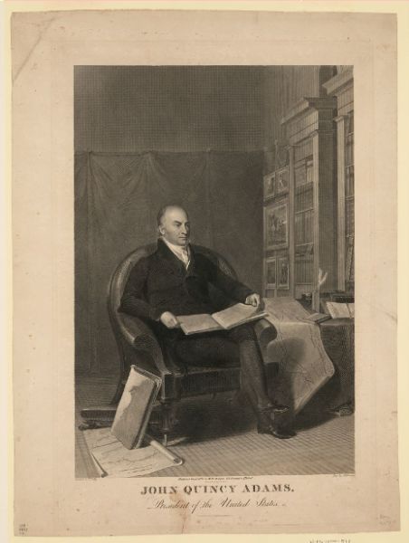A detailed black and white engraving shows a seated John Quincy Adams, President of the United States, holding an open book in his lap. He is surrounded by an elegant study, with a large bookshelf behind him and papers and a map on a table beside him.