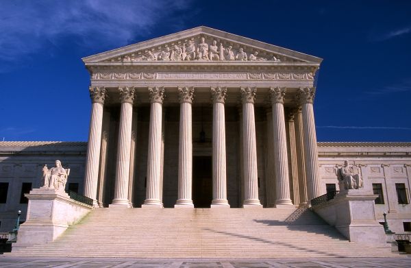 Photograph of the exterior of the United States Supreme Court Building in Washington, D.C., showing its neoclassical façade and steps leading up to the entrance.