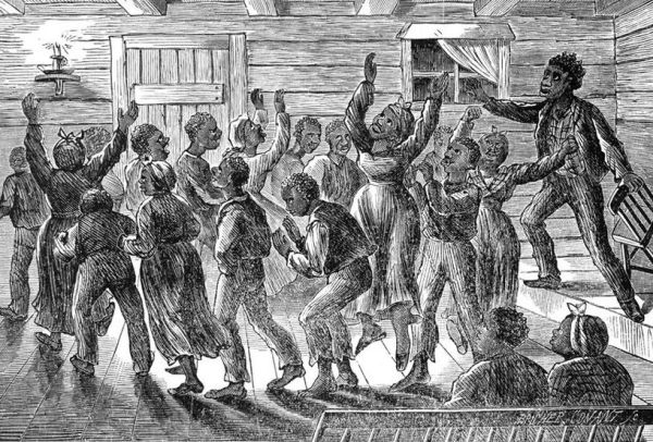This black-and-white illustration depicts a group of enslaved African Americans gathered inside a wooden building, engaged in an energetic religious service or spiritual dance, with many figures raising their hands and moving dynamically. A man on the right, possibly a preacher or leader, appears to be speaking or directing the fervent group, illustrating an important aspect of the community and culture of enslaved people.