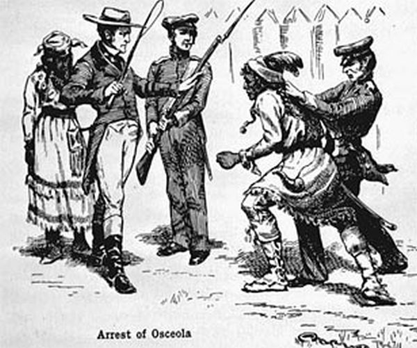 A black and white illustration depicts the arrest of Seminole Chief Osceola. Two American soldiers seize a shackled Osceola from behind, while another soldier and a woman in a long skirt observe the scene.