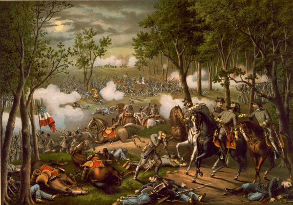A chaotic Civil War battle scene unfolds at night under a full moon, with Union and Confederate soldiers clashing amidst thick clouds of white musket smoke in a wooded area. In the foreground, officers on horseback navigate a landscape littered with fallen soldiers and horses, while a line of infantry engages in close-quarters combat further back in the clearing.